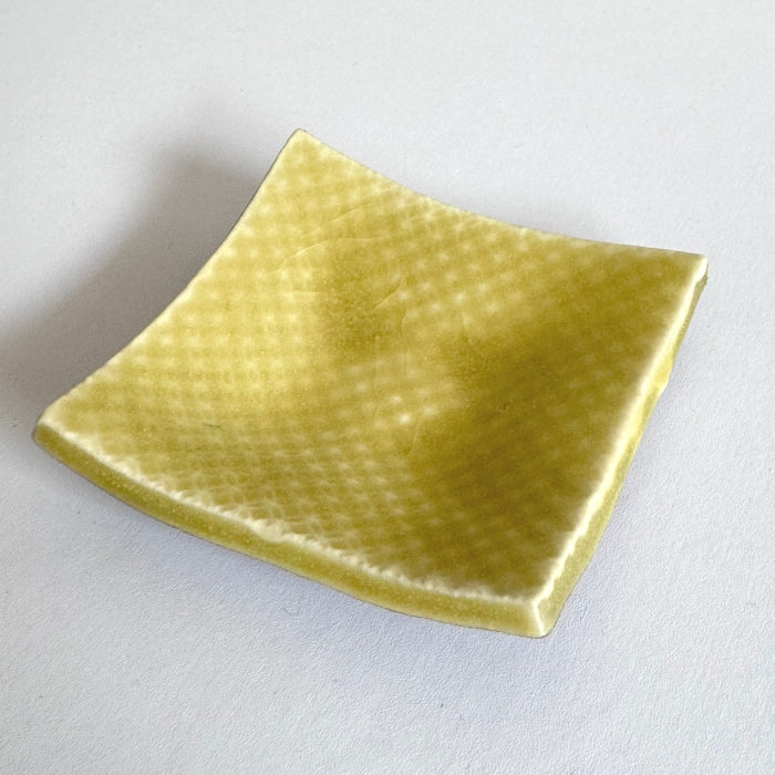 Shoyogama Mamezara Mini Curved Plate in Yellow Yuzu Glaze. Handcrafted in Hyogo Prefecture, Japan. Tamba Ware. Available at Toka Ceramics.