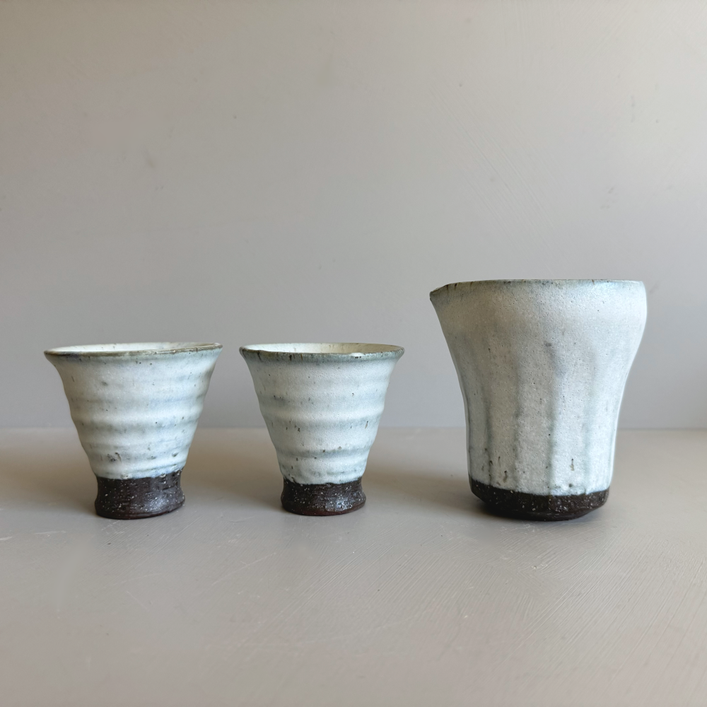 Japanese handcrafted sake set with 1 katakuchi pourer and 2 cups. Crafted by Shotoen in Gifu prefecture Japan. One of a kind pottery. Available at Toka Ceramics.