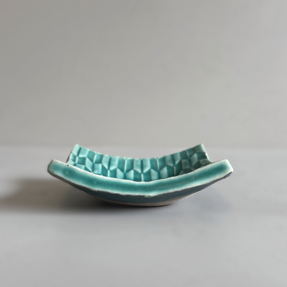 Japanese handcrafted mini curved plate, Mame zara in teal glaze colour by Shoyo Gama. Available at Toka Ceramics.