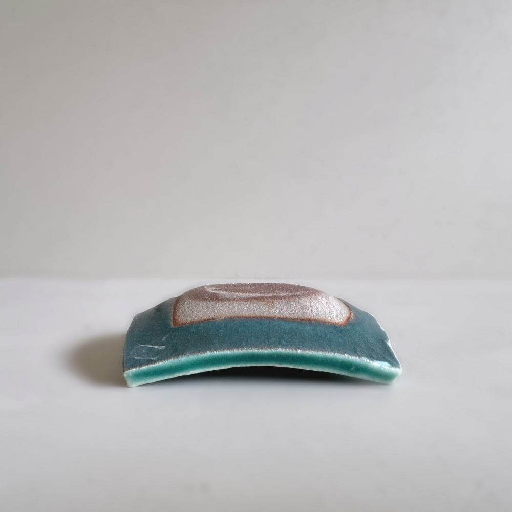 Japanese handcrafted mini curved plate, Mame zara in teal glaze colour by Shoyo Gama. Available at Toka Ceramics.