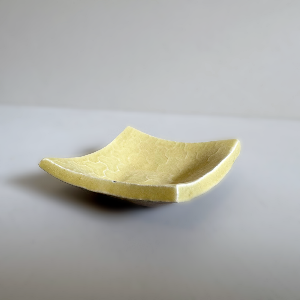 Japanese handcrafted mini curved plate, Mame zara in yuzu colour glaze by Shoyo Gama. Available at Toka Ceramics.