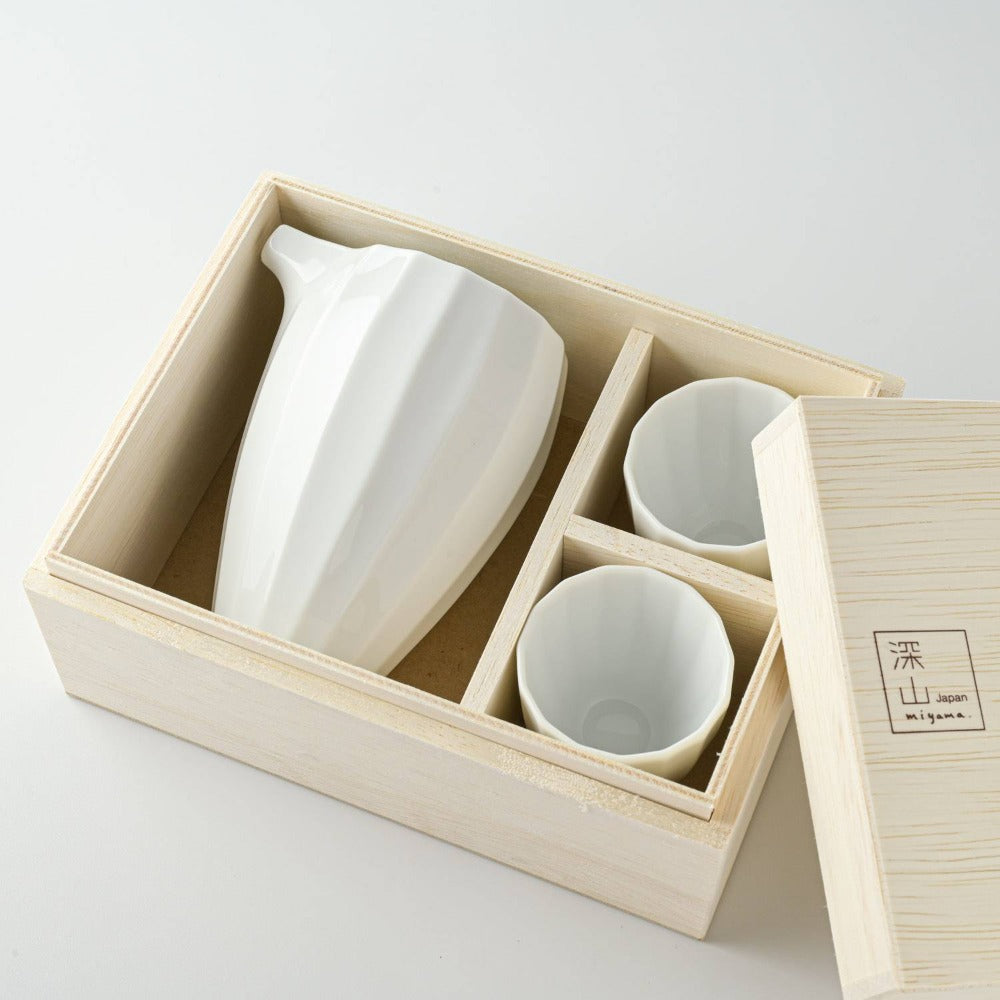 Miyama white porcelain sake set, comes with 1 sake pourer and 2 cups in a wooden gift box. Made in Gifu prefecture, Japan. Mino ware. Available at Toka Ceramics.
