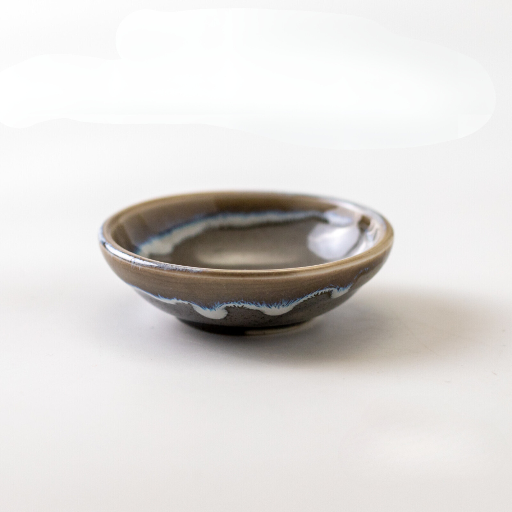 Small rounded sauce dish. Made in Japan. Available at Toka Ceramics.