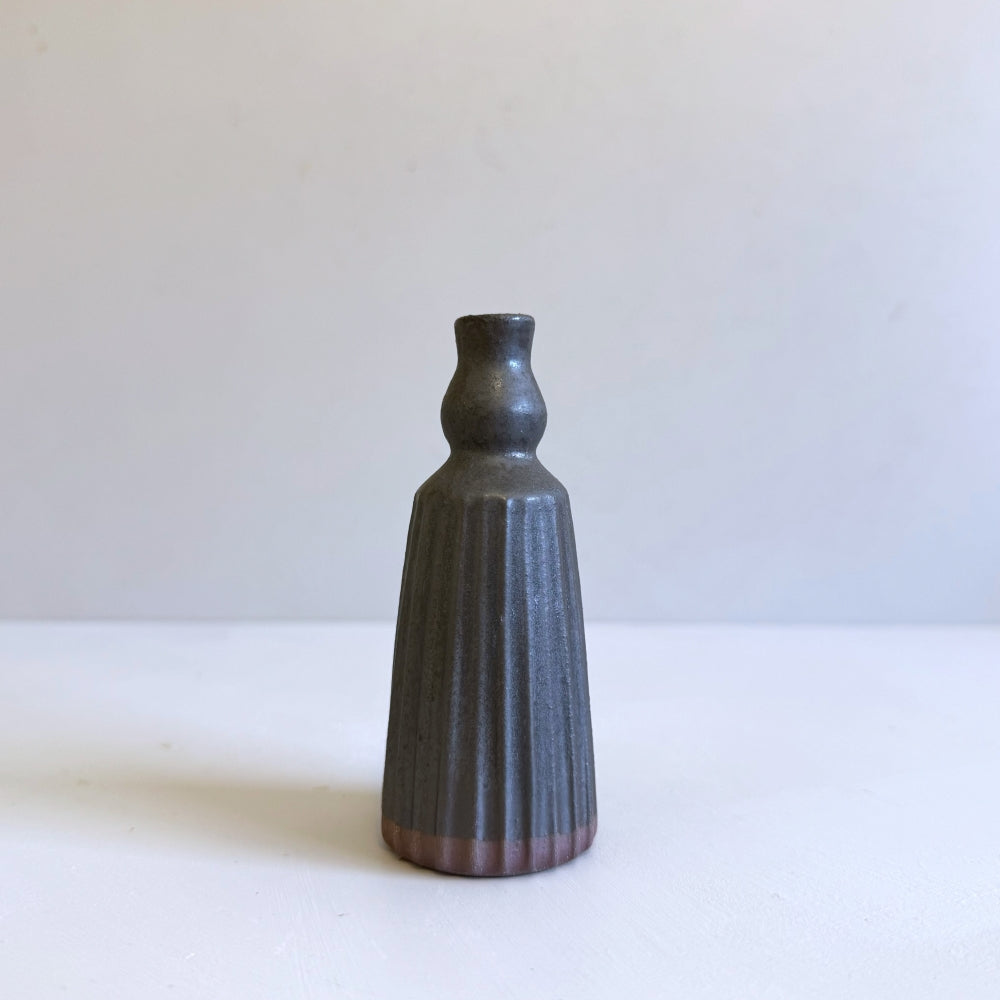 Small pottery stem vase in black glaze. Handcrafted in Japan, Tamba ware. Available at Toka Ceramics.