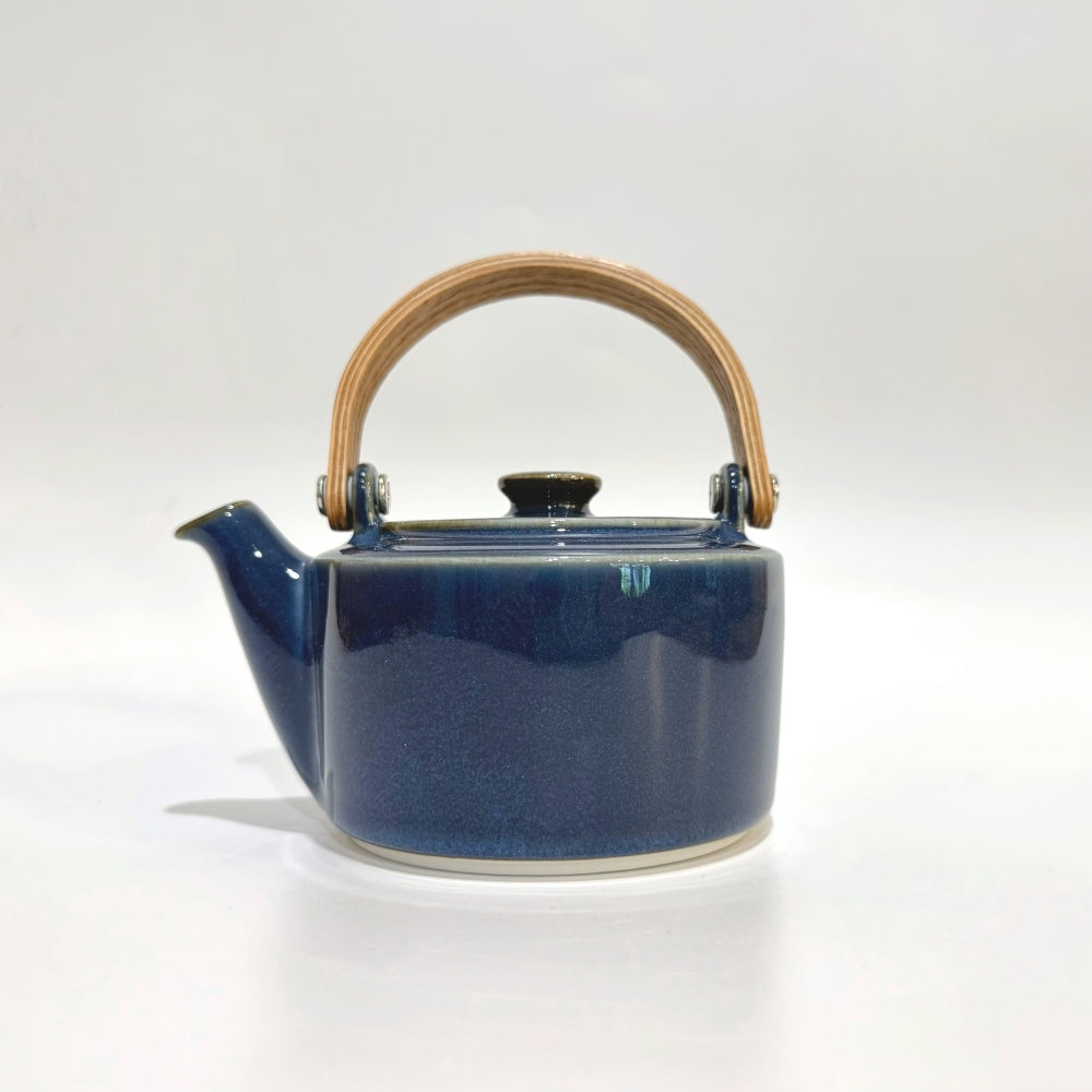 Japanese teapot with wooden handle in Indigo colour. Handcrafted in Gifu prefecture, Japan. Available at Toka Ceramics.
